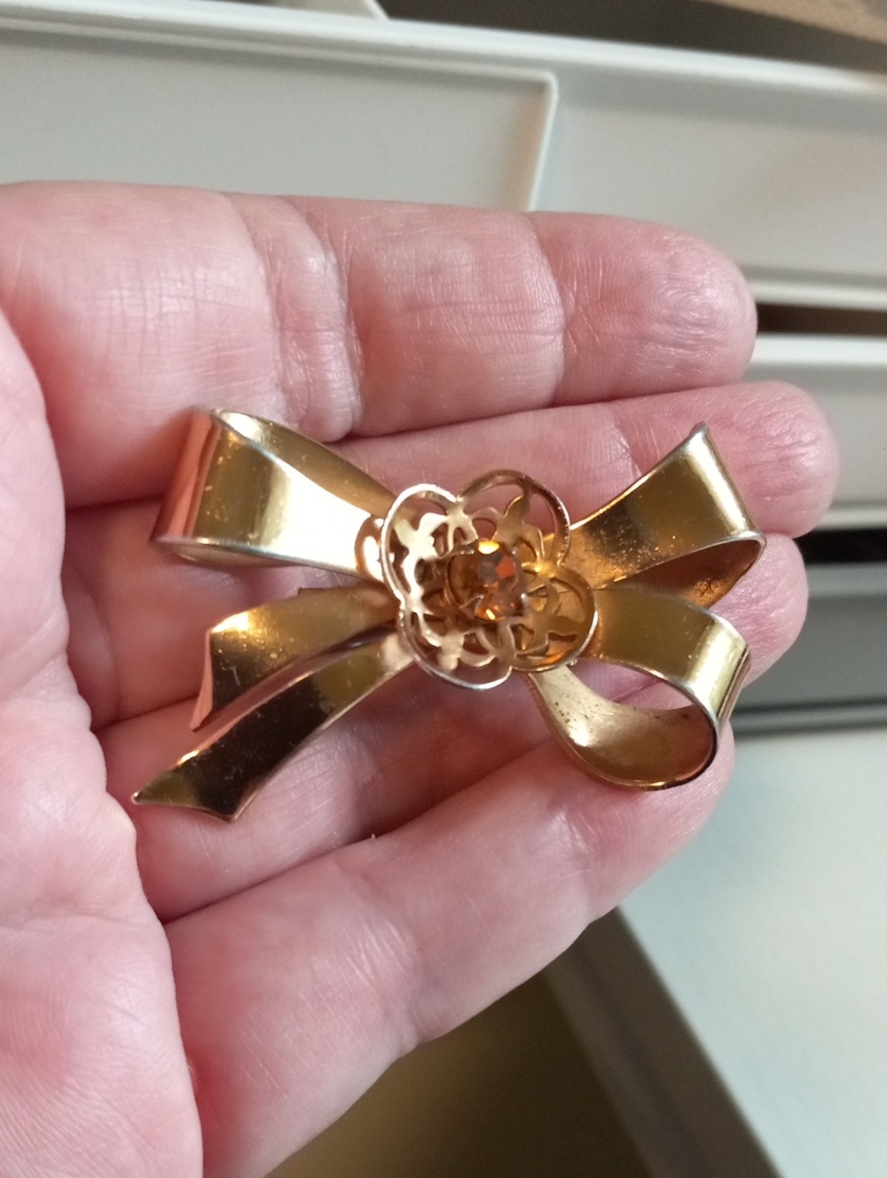 Vintage Gold Tone Bow w/ Amber Coloured Glass